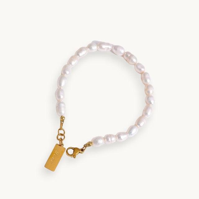 pearl beaded bracelet on a white backgroun