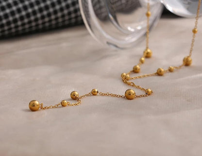 Gold Beaded Lariat Necklace