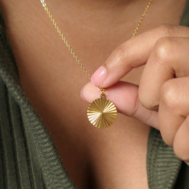 Circle sunburst necklace on model