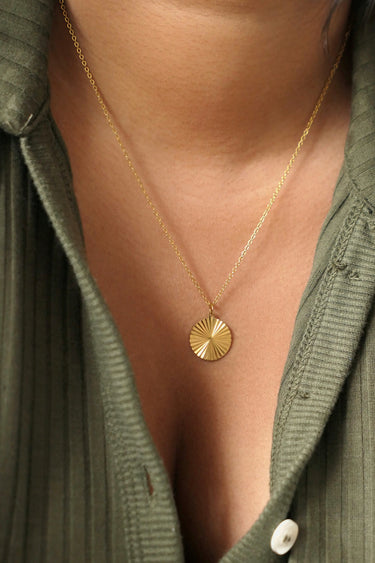 Circle sunburst necklace on model