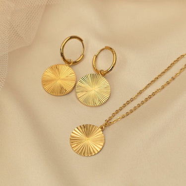 Circle sunburst pendant necklace and matching hoops in gold