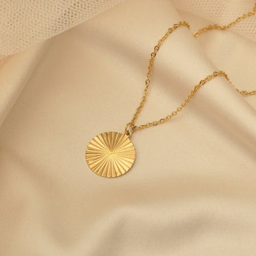 Sunburst necklace flatlay photo